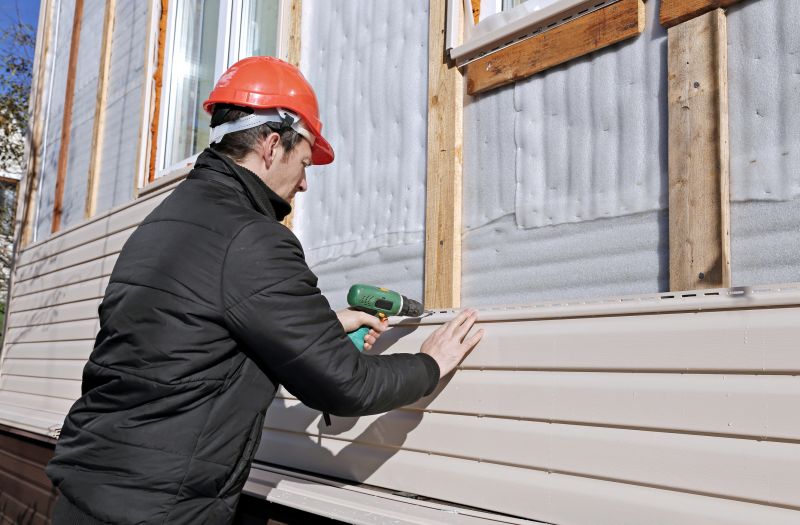 Siding Installer Using Power Tools
